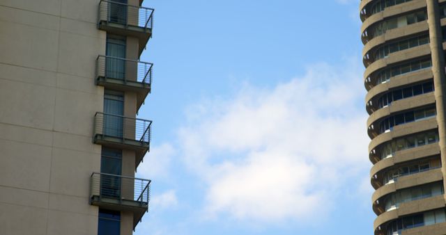 Modern High-Rise Buildings Against Blue Sky with Clouds on Sunny Day - Download Free Stock Images Pikwizard.com