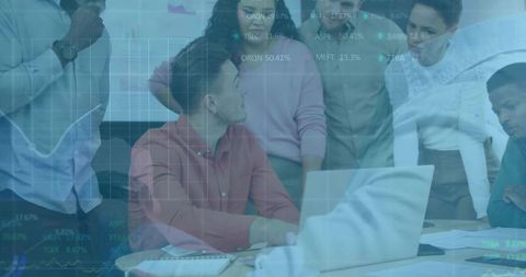 Diverse Business Team Collaborating on Strategy with Digital Data Displays