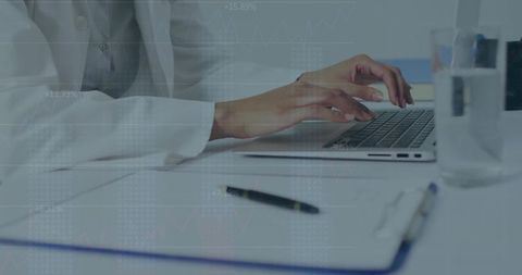 Mid-adult woman typing on laptop at minimalist office desk with analytics charts overlay