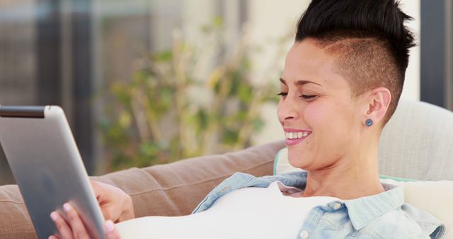 Person Relaxing on Couch Using Tablet Computer - Download Free Stock Images Pikwizard.com