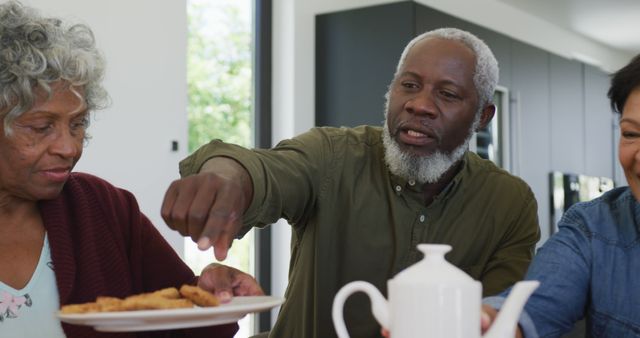 Senior Friends Enjoying Tea and Cookies Together at Home - Download Free Stock Images Pikwizard.com