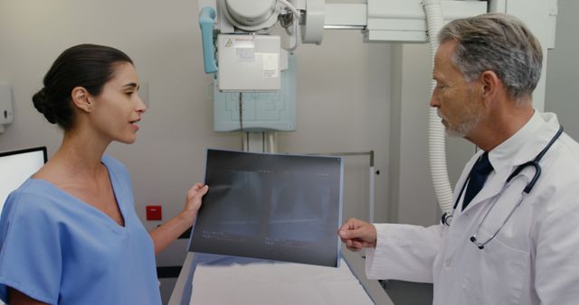 Doctors Discussing X-Ray Results in Hospital Radiology Room - Download Free Stock Images Pikwizard.com