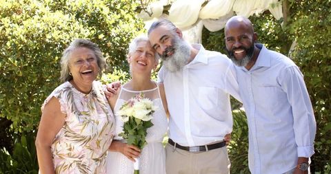Senior Friends Posing Together at Outdoor Wedding