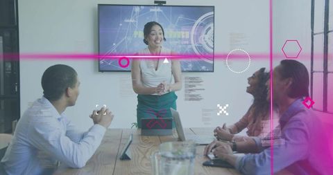 Presenting Team Leader Engaging Colleagues in Modern Conference Room with Tech Overlays