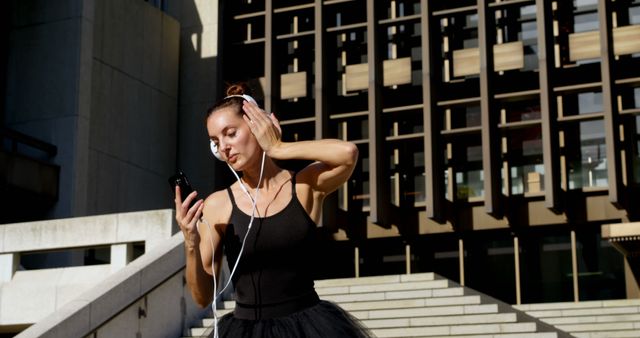 Ballet Dancer Listening to Music on Headphones Outdoors - Download Free Stock Images Pikwizard.com