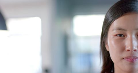 Asian Businesswoman in Bright Office Environment