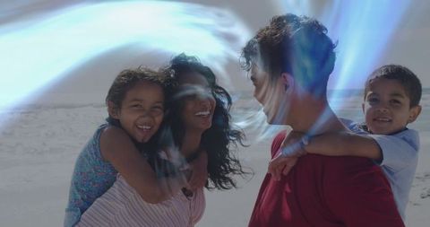 Family Enjoying Piggyback Rides on Sunny Beach with Bright Reflections