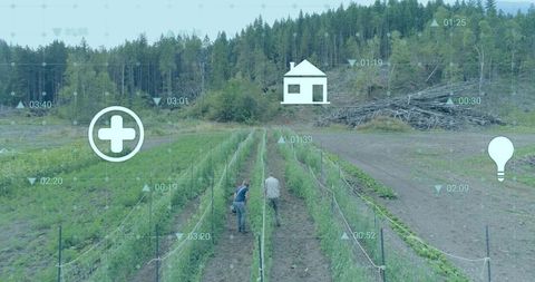 Farmers inspecting trellised crops with digital graphics overlay