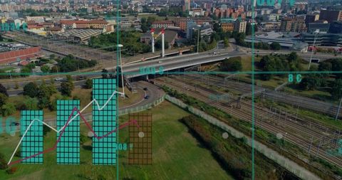 Aerial view showing highway overpass and railway corridor with digital data overlay
