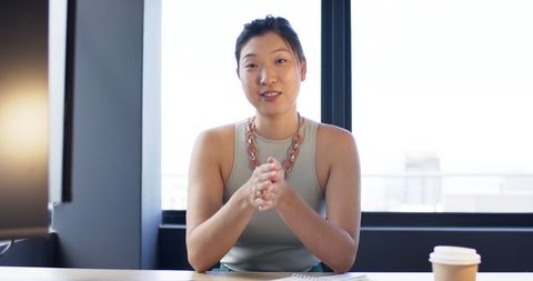 Confident Asian Businesswoman in Contemporary Office Setting