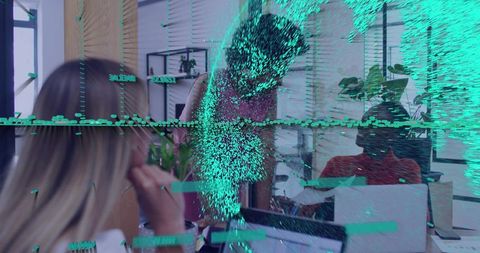 Female Colleagues Collaborating Over Laptops in Open Office with Digital Glitch Overlay