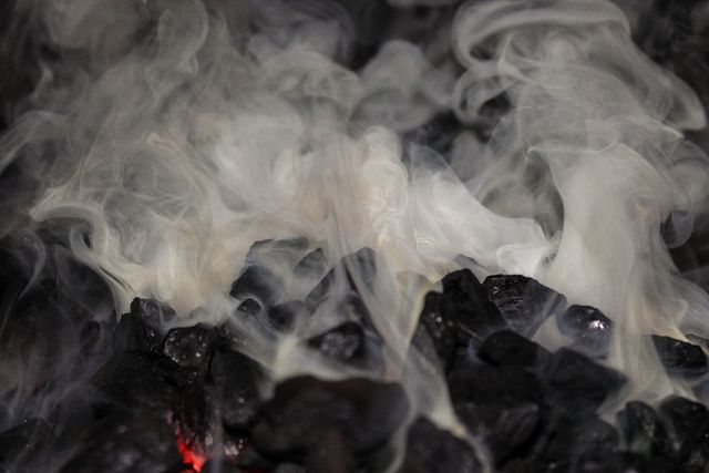 Smoldering Coals with Rising Smoke Showing Intense Heat and Energy - Download Free Stock Photos Pikwizard.com