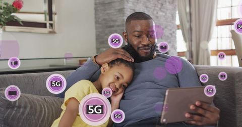 Father and Daughter Enjoying 5G Connectivity Digital Experience at Home