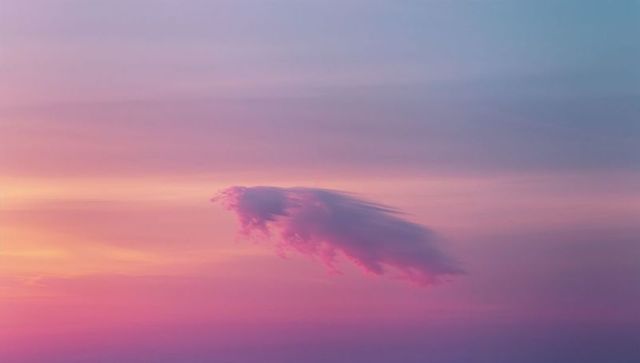 Serene Wispy Cloud in Vivid Twilit Sky