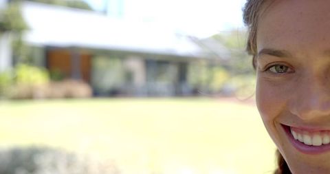 Smiling Woman Enjoying a Sunny Day Outdoors
