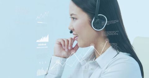 Asian Businesswoman with Headset Analyzing Financial Data