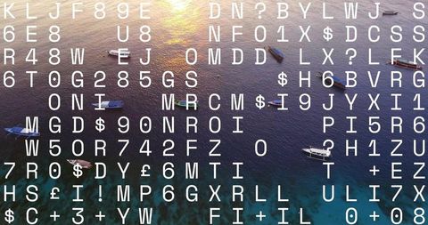 Aerial coastal seascape glowing under low sun with boats, reef and overlaid white symbol grid