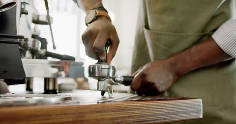 Barista Crafting Espresso Coffee in Cozy Café Setting