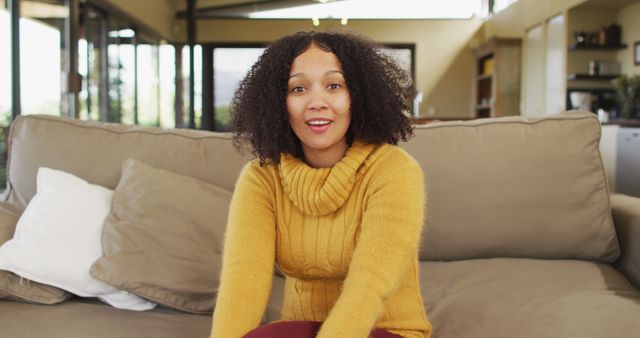 Smiling Woman Sitting on Sofa at Home - Download Free Stock Images Pikwizard.com