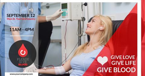 Smiling woman donating blood at health awareness event