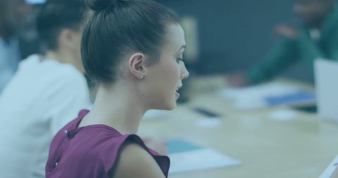 Focused Businesswoman Collaborating in Modern Office Meeting