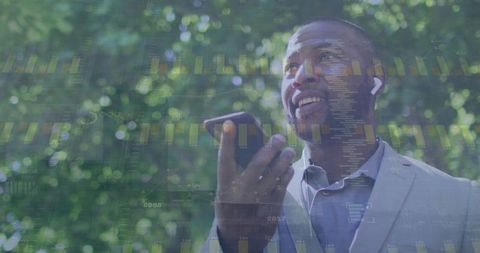 African American Businessman Engaging with Smartphone Amid Digital Data Overlay