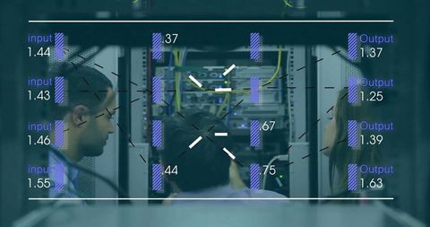 Diverse Workers Analyzing Data in Server Room Concept