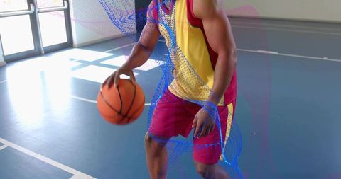 Basketball Player in Action on Indoor Court