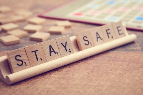 Stay safe message using wooden scrabble tiles