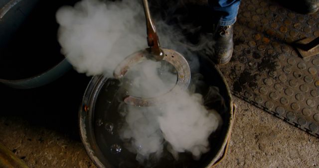 Blacksmith Cooling Horseshoe in Water with Steam - Download Free Stock Photos Pikwizard.com