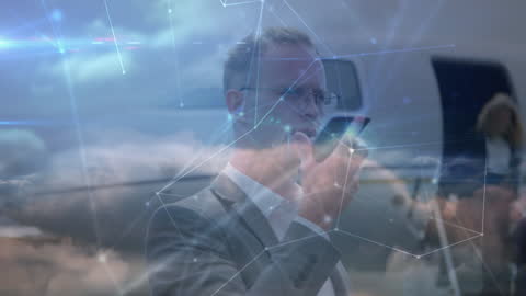 Businessman Conducts Global Call with Digital Interface Overlay