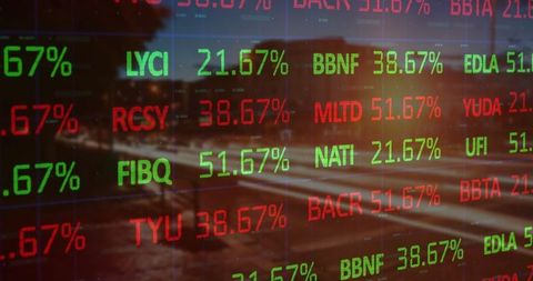 Digital Stock Ticker Reflected in Urban Nightscape with Light Trails