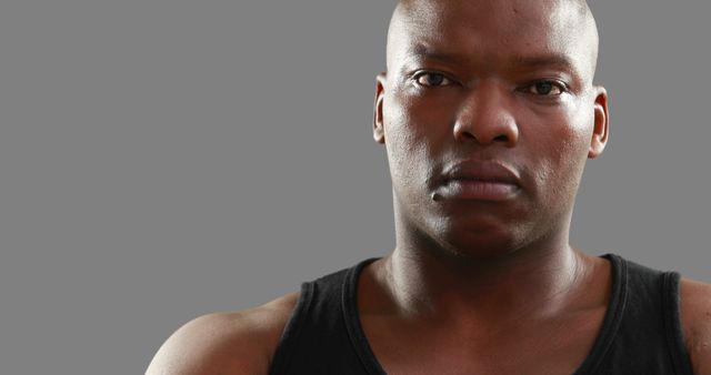 African American man in black tank top looking serious - Download Free Stock Images Pikwizard.com