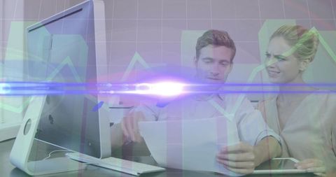 Corporate Team Collaborating on Data Analysis with Modern Technology