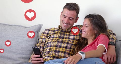 Happy Couple Using Smartphone with Love Icons