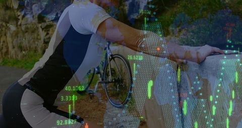 Cyclist resting on stone wall with data overlay showing cycling performance metrics
