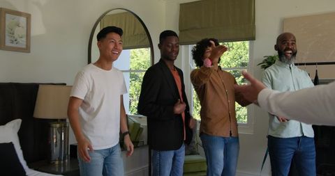Groom getting ready with friends for wedding celebration