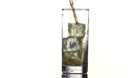 Cola Pouring into Ice-filled Glass in Super Slow Motion