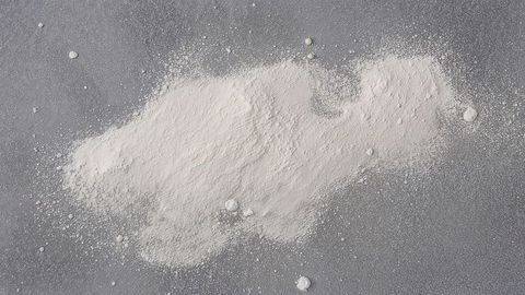 White Flour Pile on Gray Kitchen Countertop for Culinary Preparation