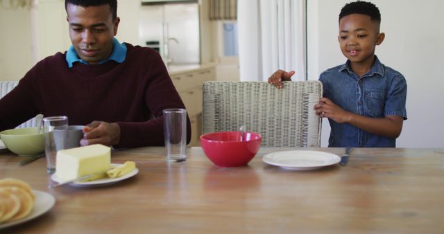 Father and Son Preparing Breakfast Together in Kitchen - Download Free Stock Images Pikwizard.com