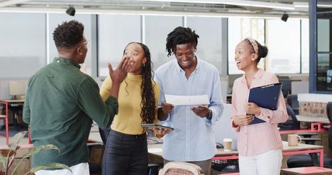 African American Colleagues Collaborating in Modern Office Space