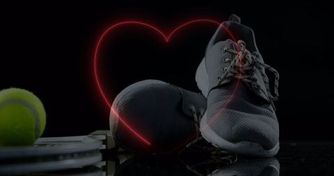 Sports Shoes with Neon Heart on Black Background