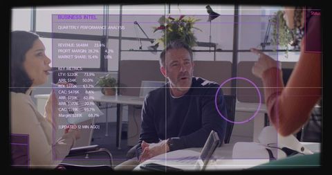 Leader presenting strategy during modern team meeting with analytics dashboard overlay