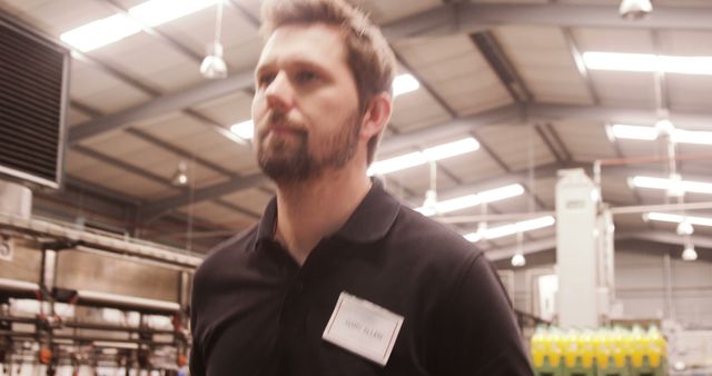 Factory Worker in Uniform Walking in Industrial Warehouse - Download Free Stock Images Pikwizard.com