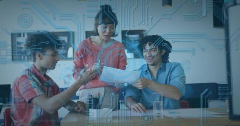 Presenting and collaborating on tech project with circuit overlay in modern workspace