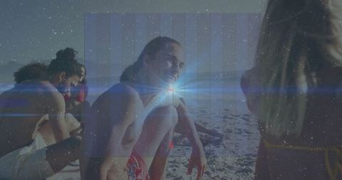 Young people relaxing and enjoying sunny beach day