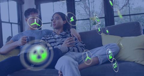 Couple Relaxing on Couch Viewing AR Energy Icons and Home Sustainability Insights