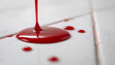 Red Liquid Pouring onto White Tiles in Slow Motion Close-Up