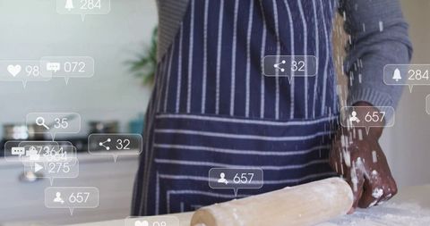 Man baking with rolling pin surrounded by social media notifications