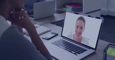 Remote Collaboration Meeting with Female Colleagues on Laptop Screen